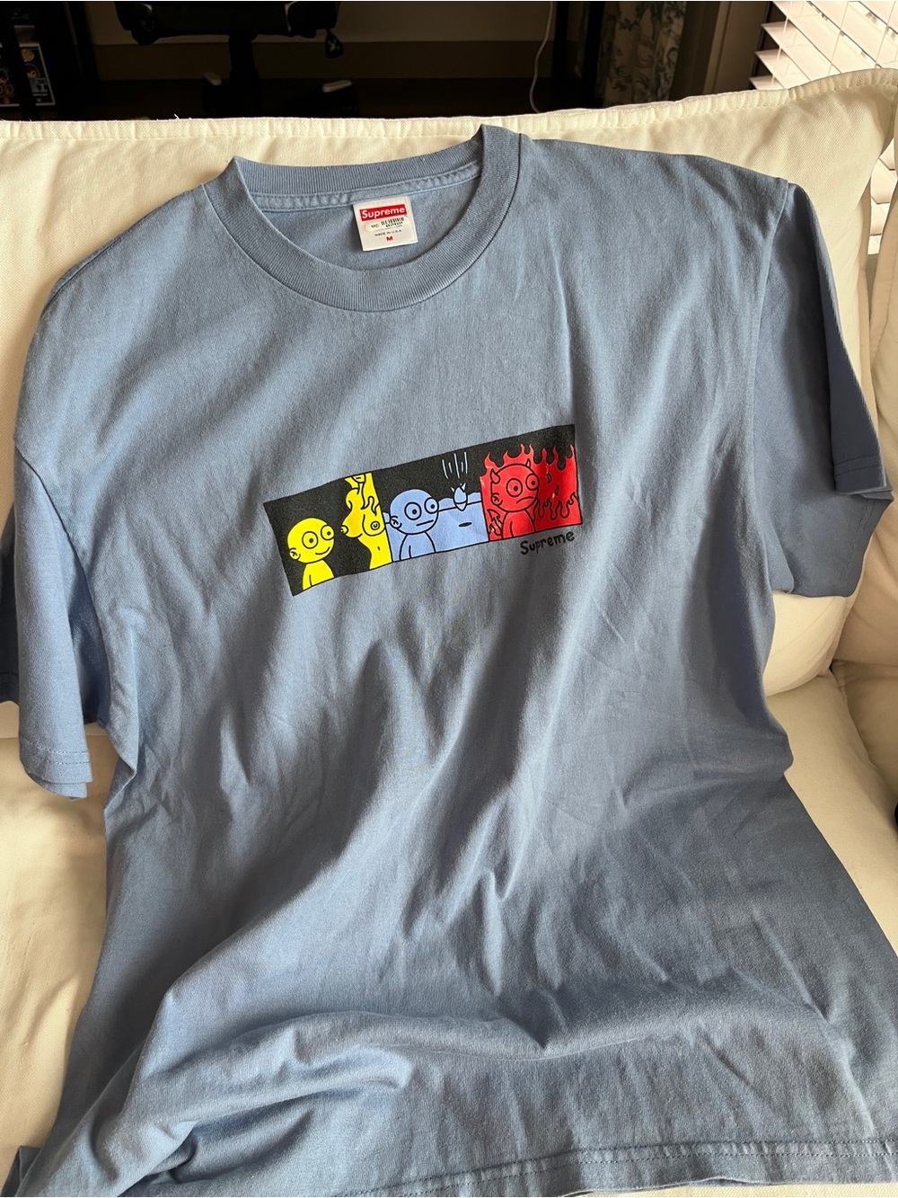 Supreme Life Tee Light Blue Tee with Yellow, Blue and Red Cartoon Panel
